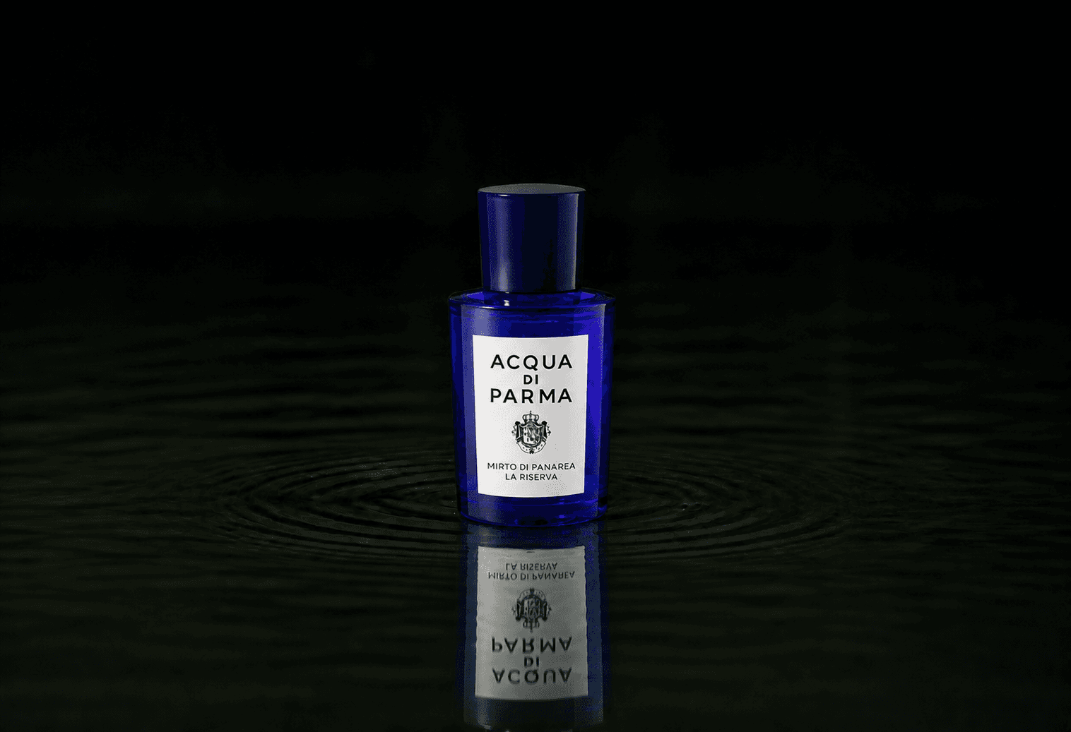 Acqua Di Parma Mirto di Panarea La Riserva fragrance bottle floating above dark water