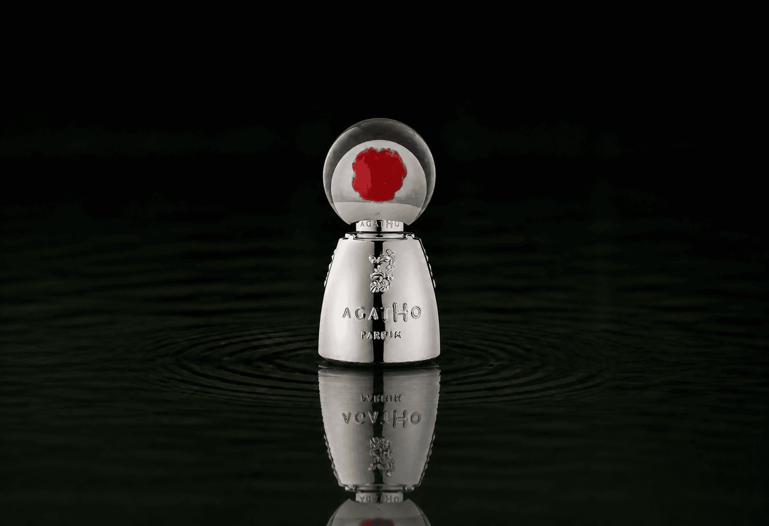 Agatho 195 A.C. fragrance bottle floating above dark water