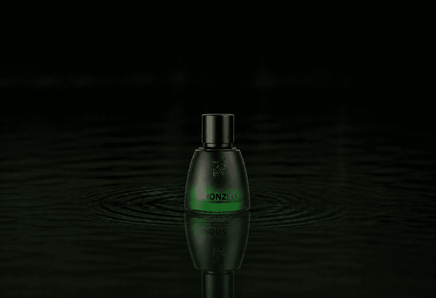 Agatho Bronzeo fragrance bottle floating above dark water