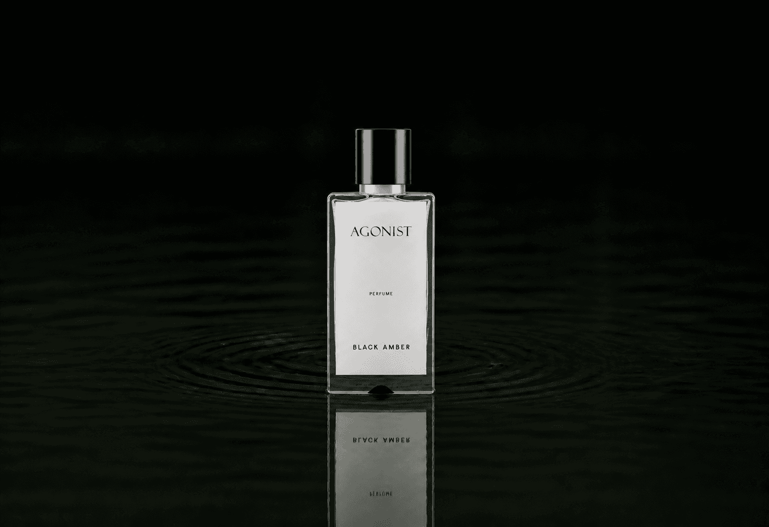 Agonist Black Amber Perfume fragrance bottle floating above dark water