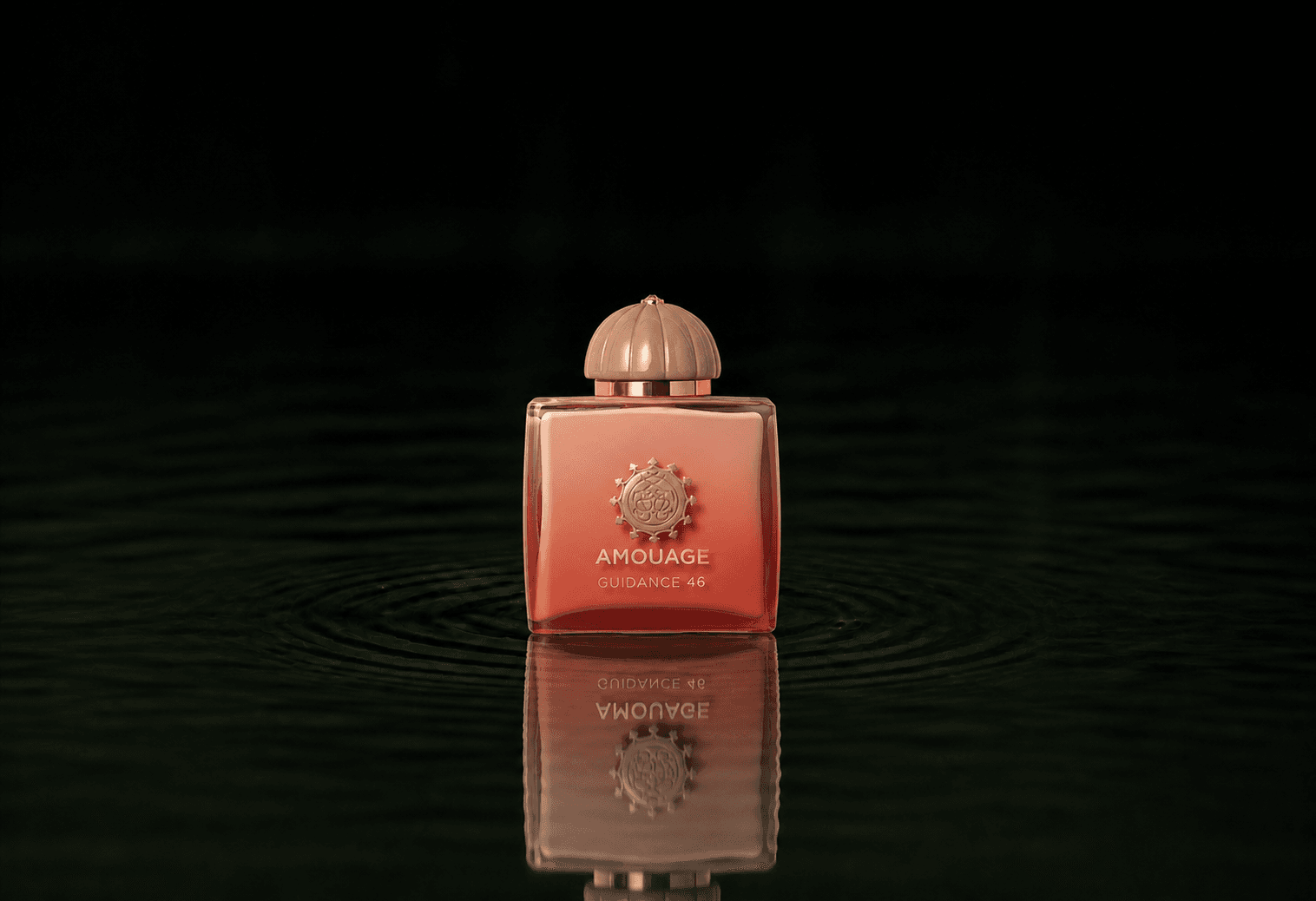 Amouage Guidance 46 EXDP fragrance bottle floating above dark water