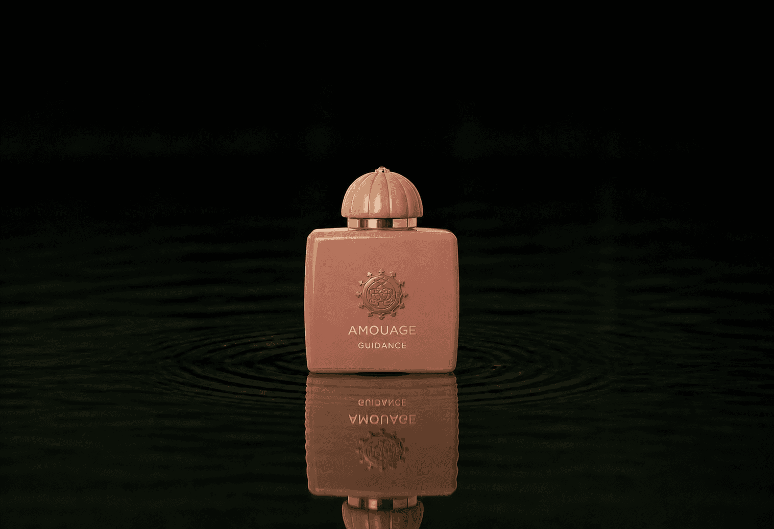 Amouage Guidance fragrance bottle floating above dark water