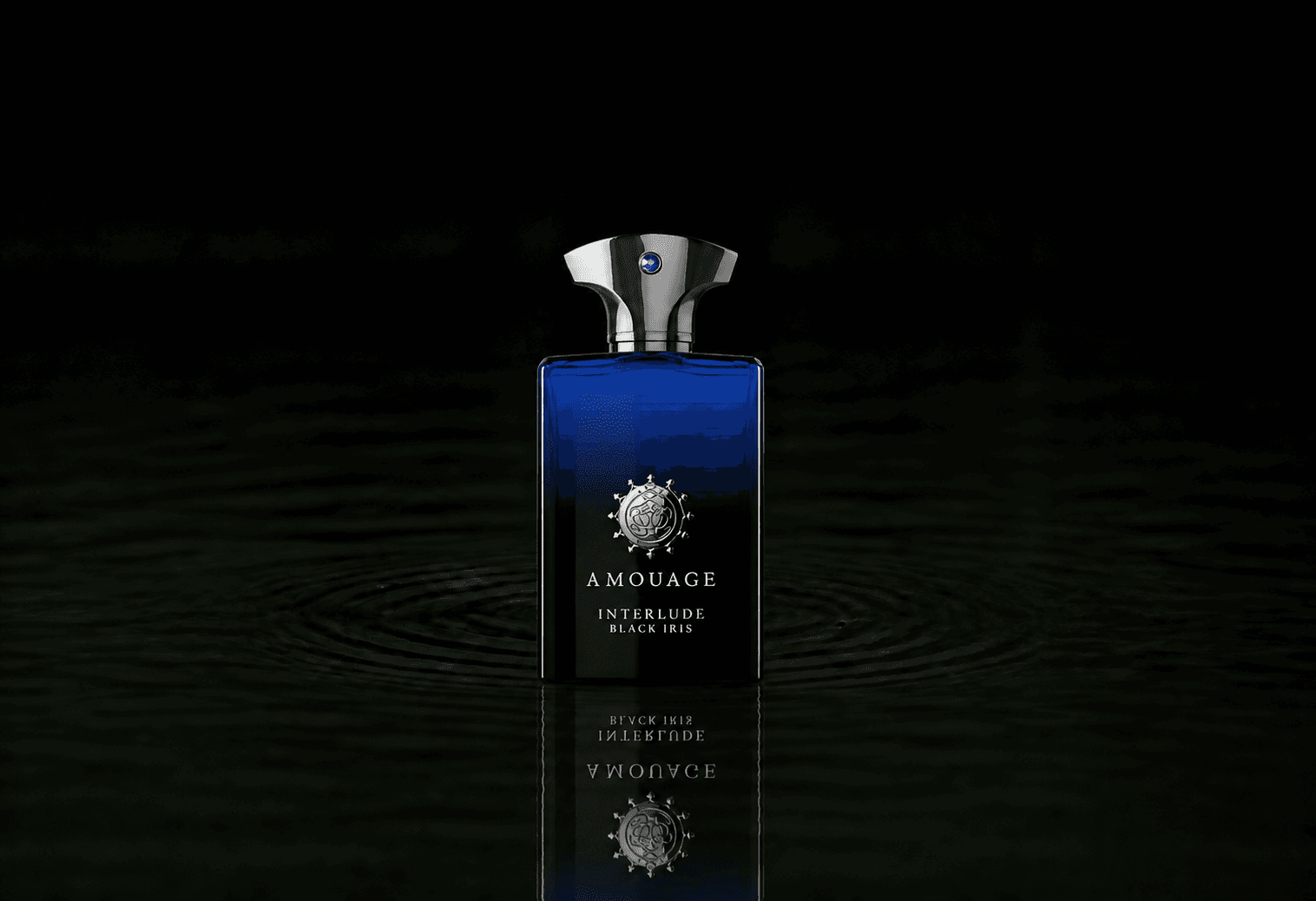Amouage Interlude Black Iris Man fragrance bottle floating above dark water