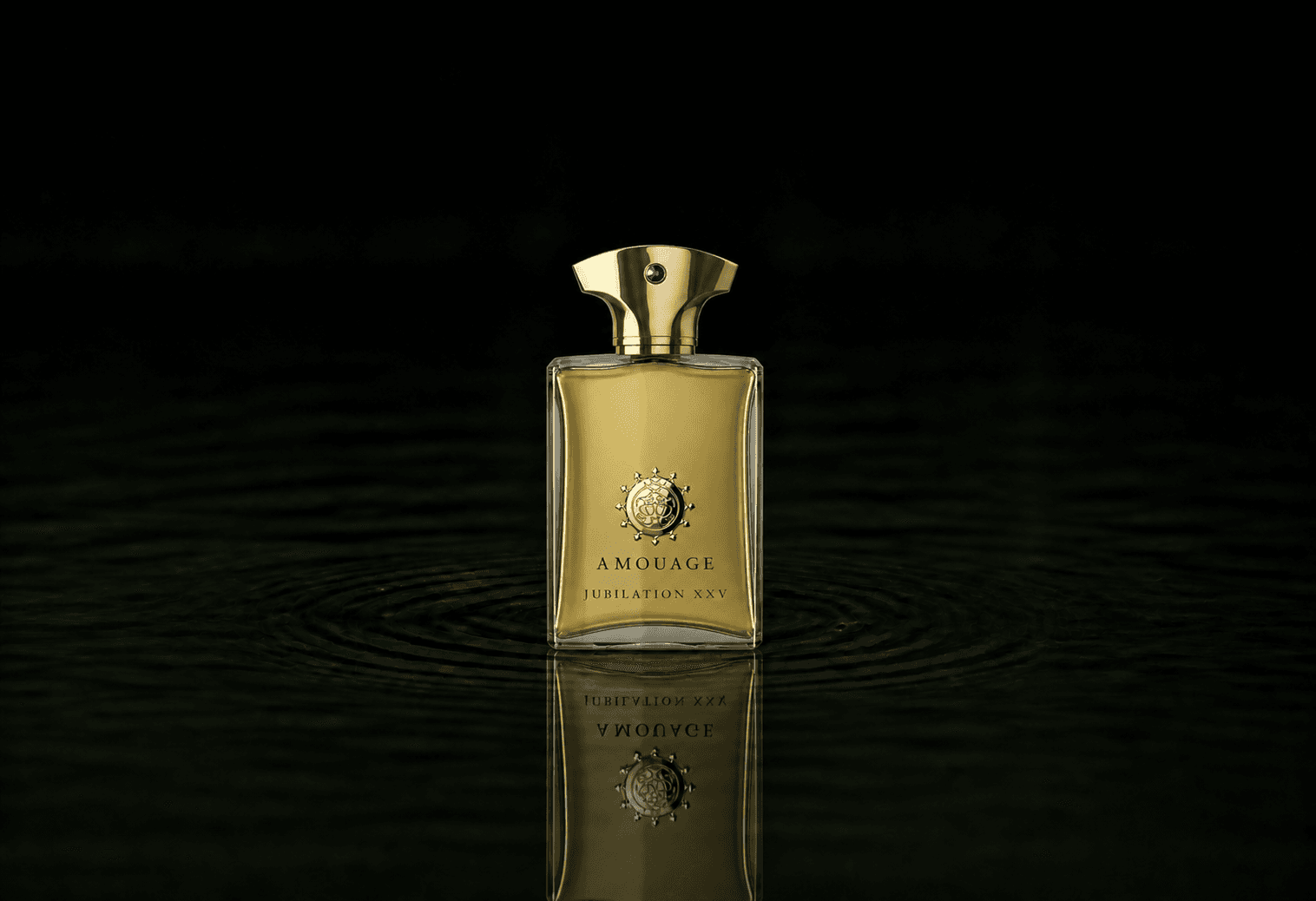 Amouage Jubilation XXV for Men fragrance bottle floating above dark water