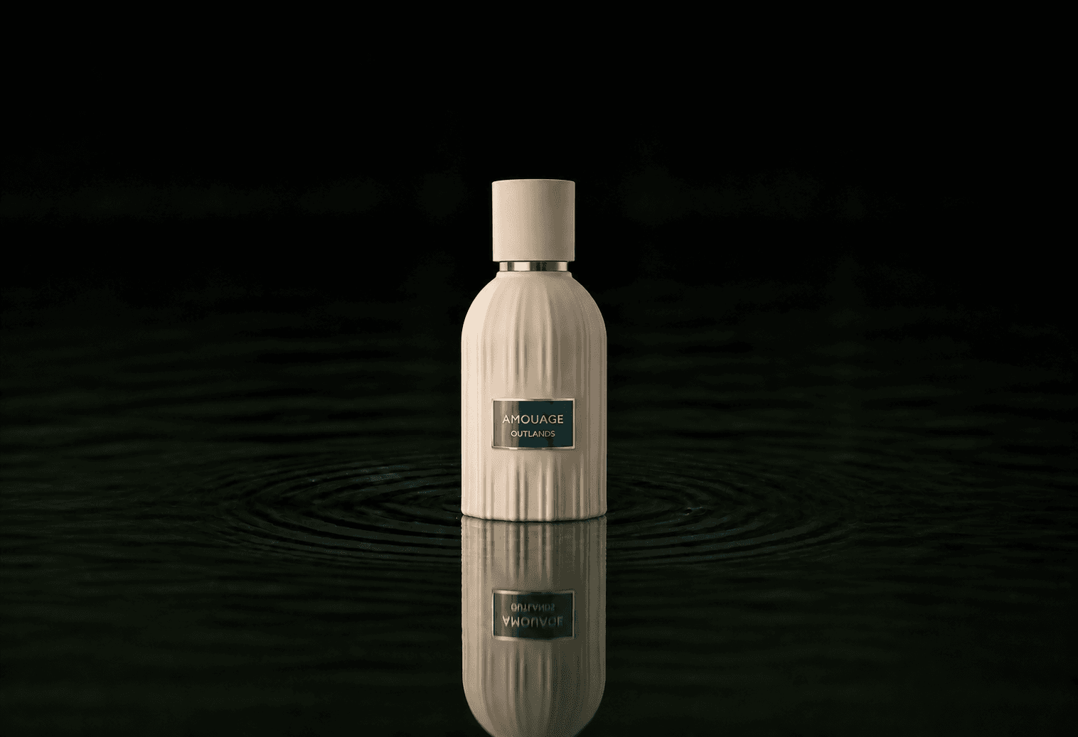 Amouage The Essences - Outlands fragrance bottle floating above dark water