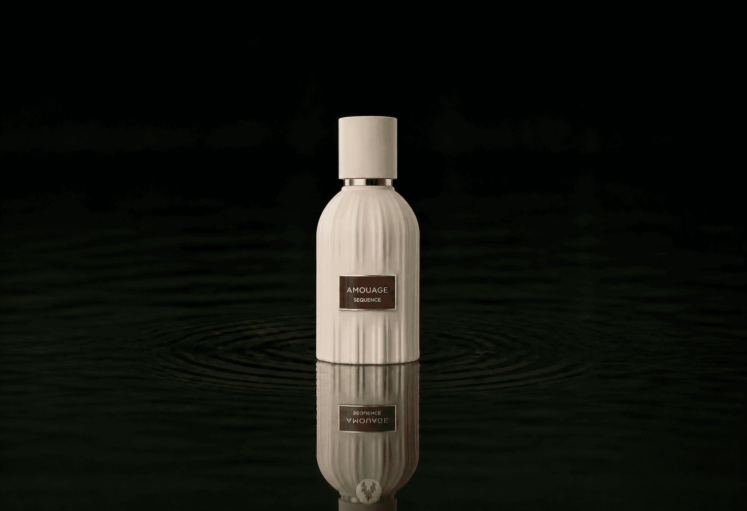 Amouage The Essences - Sequence fragrance bottle floating above dark water
