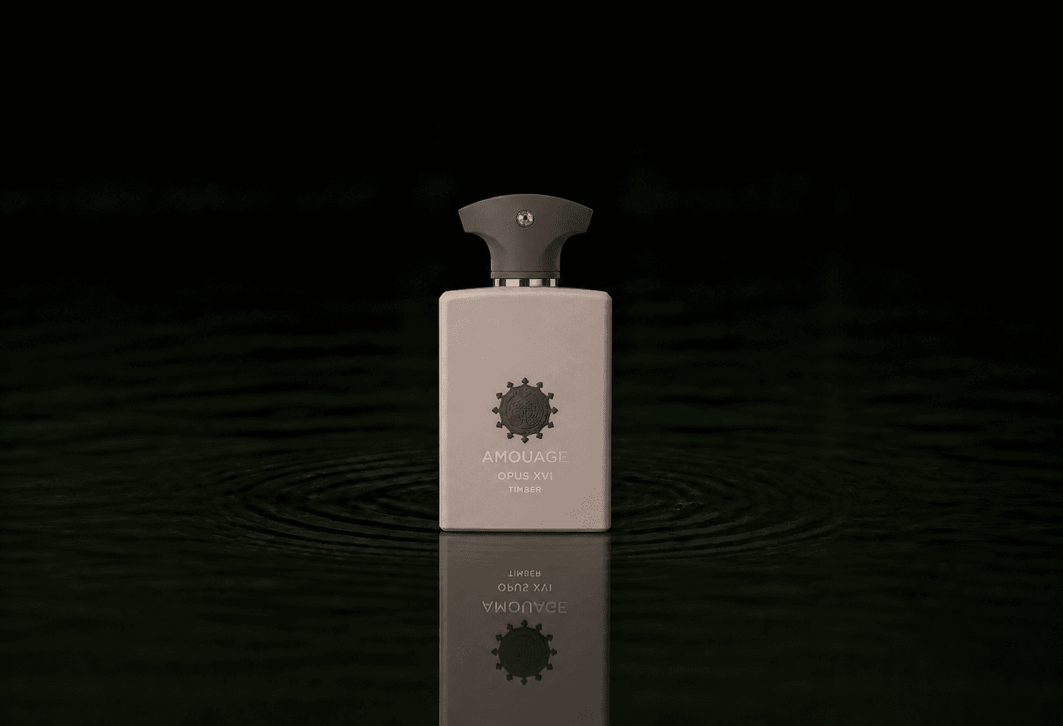 Amouage The Library Collection - Opus XVI - Timber fragrance bottle floating above dark water