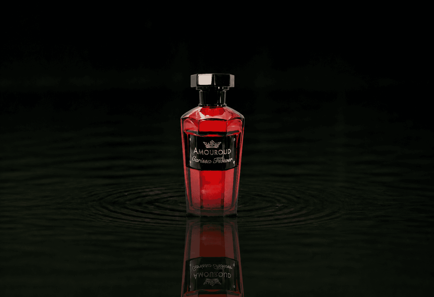 Amouroud Carissa Flower fragrance bottle floating above dark water