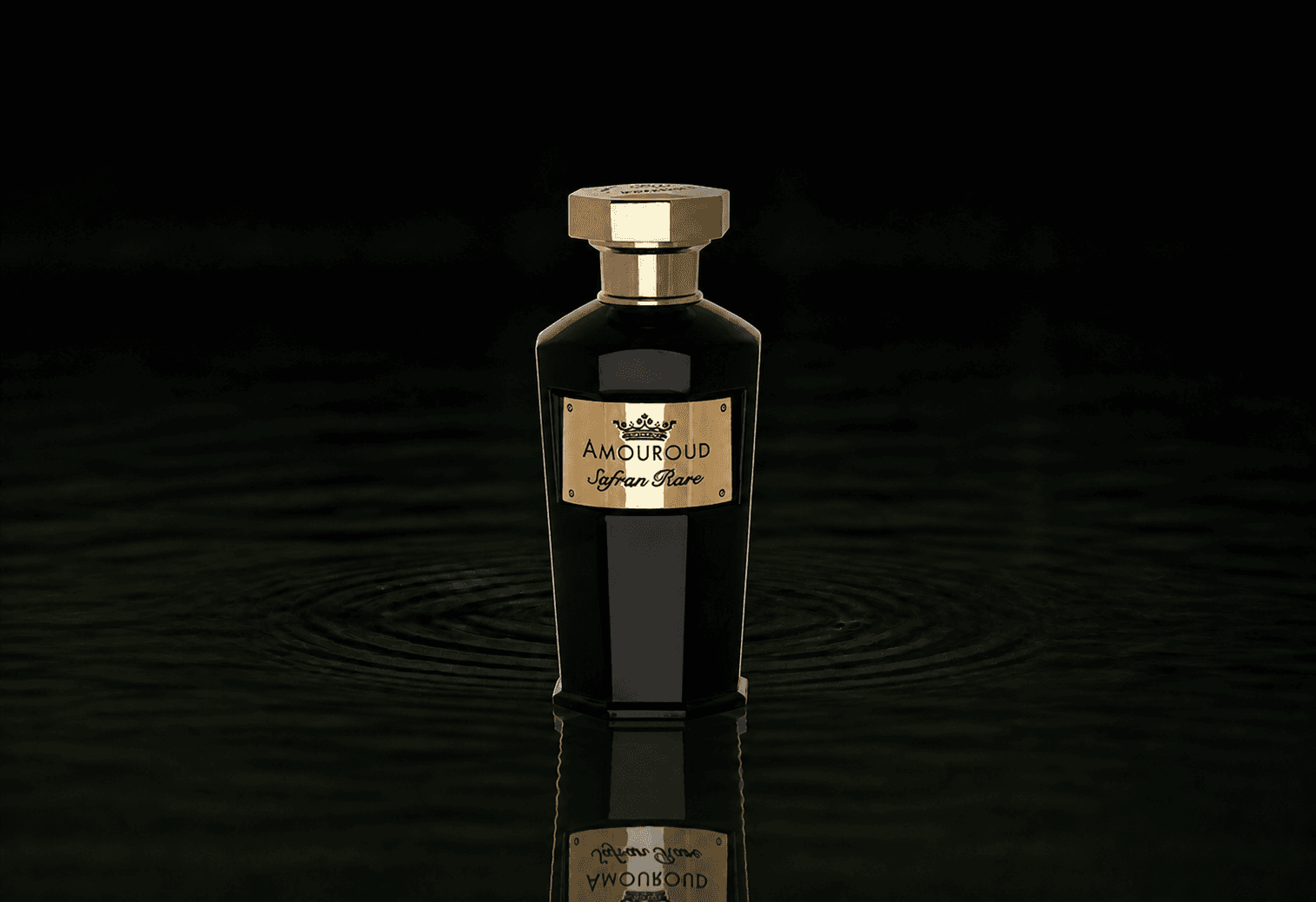 Amouroud Safran Rare fragrance bottle floating above dark water