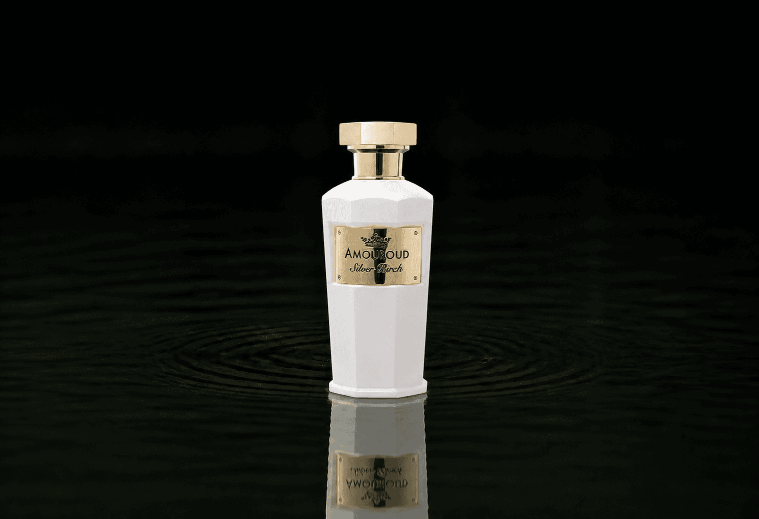Amouroud Silver Birch fragrance bottle floating above dark water