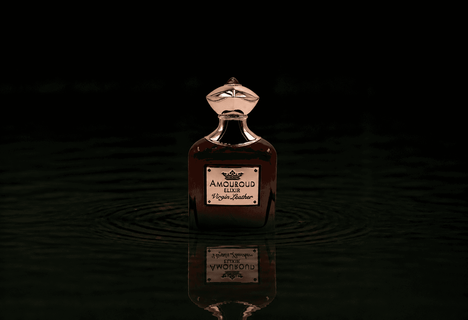 Amouroud Virgin Leather Elixir De Parfum fragrance bottle floating above dark water