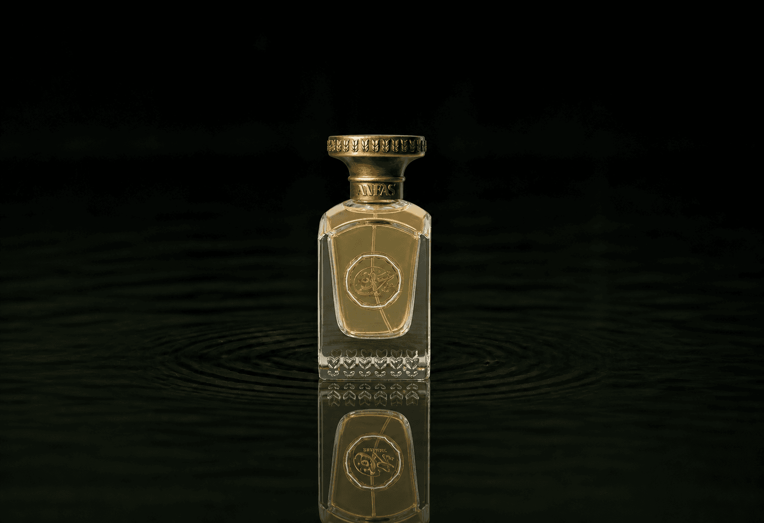 Anfas Sa'Adah fragrance bottle floating above dark water