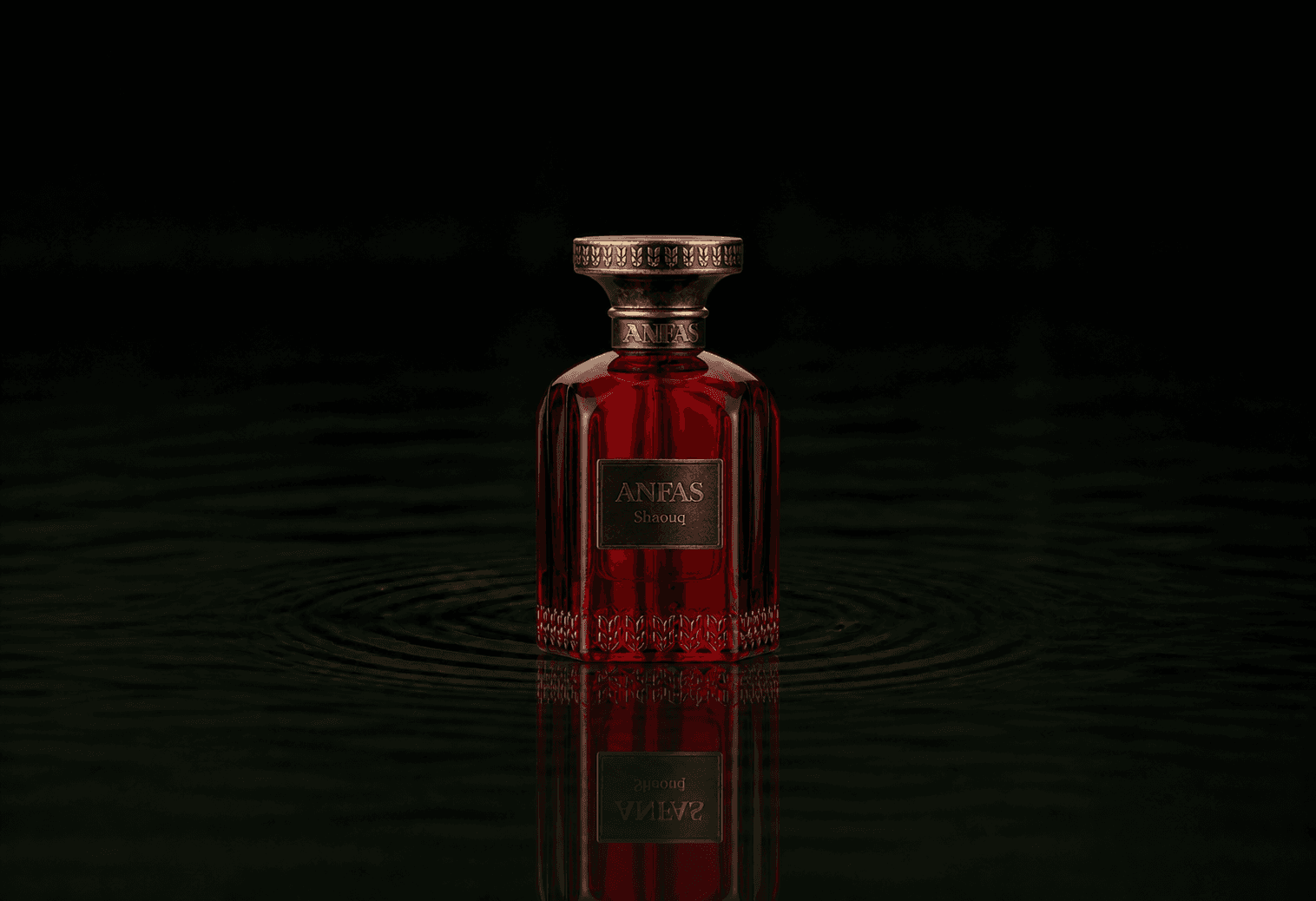 Anfas Shaouq fragrance bottle floating above dark water