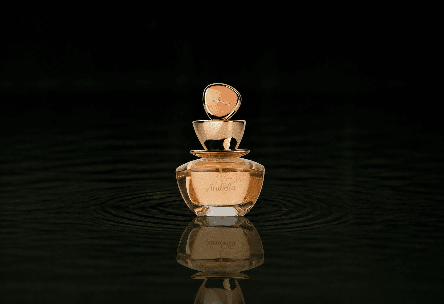 Arabian Oud Arabella fragrance bottle floating above dark water