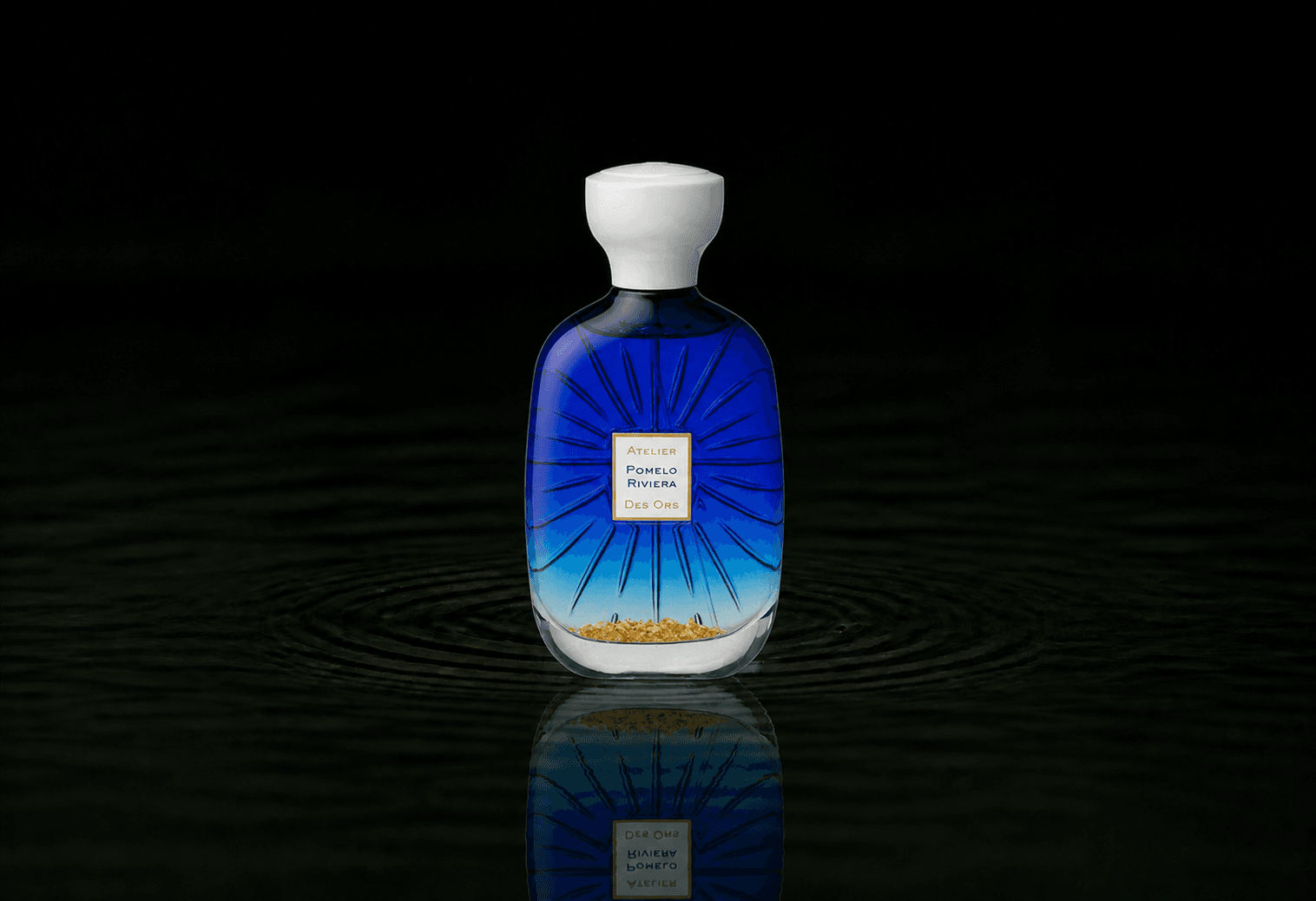 Atelier Des Ors Atelier Des Ors - Riviera Collection - Pomelo Riviera fragrance bottle floating above dark water