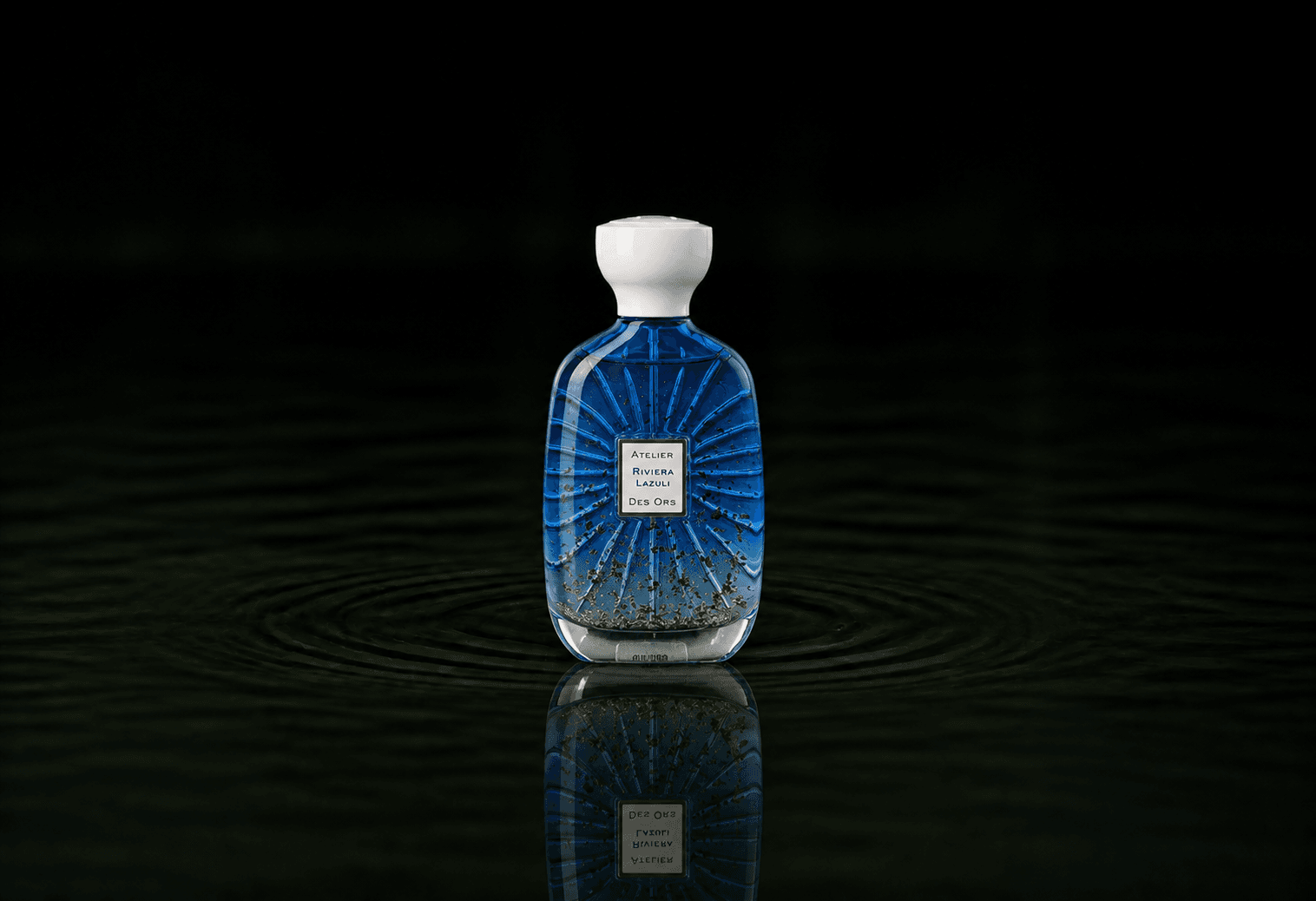 Atelier Des Ors Atelier Des Ors - Riviera Collection - Riviera Lazuli fragrance bottle floating above dark water