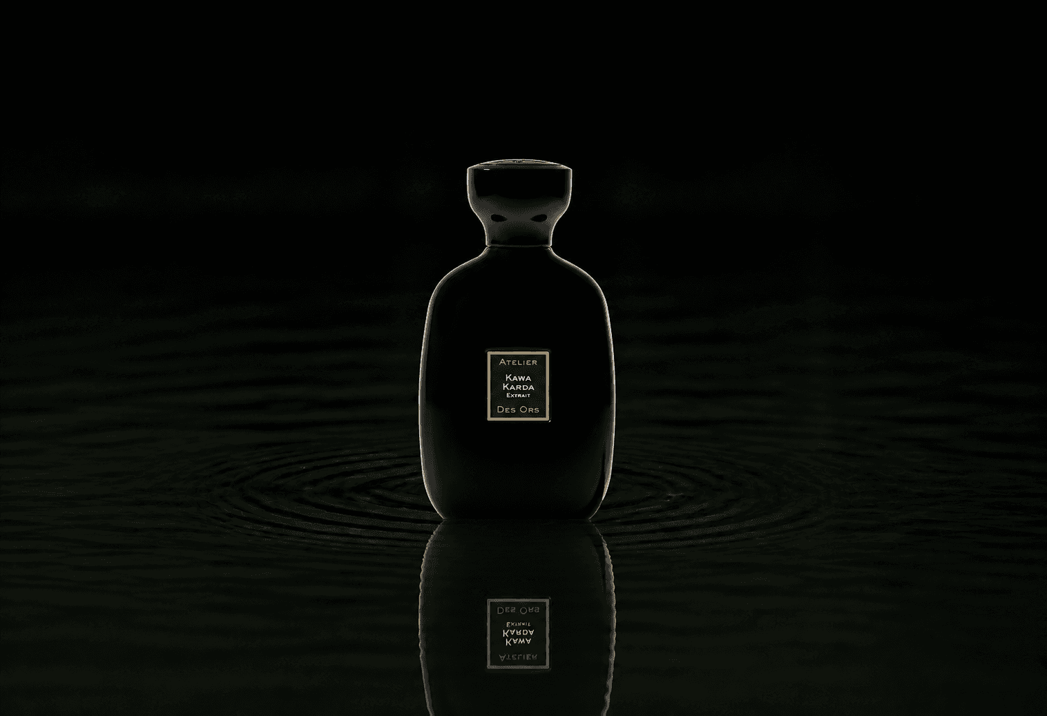 Atelier Des Ors Kawa Karda fragrance bottle floating above dark water