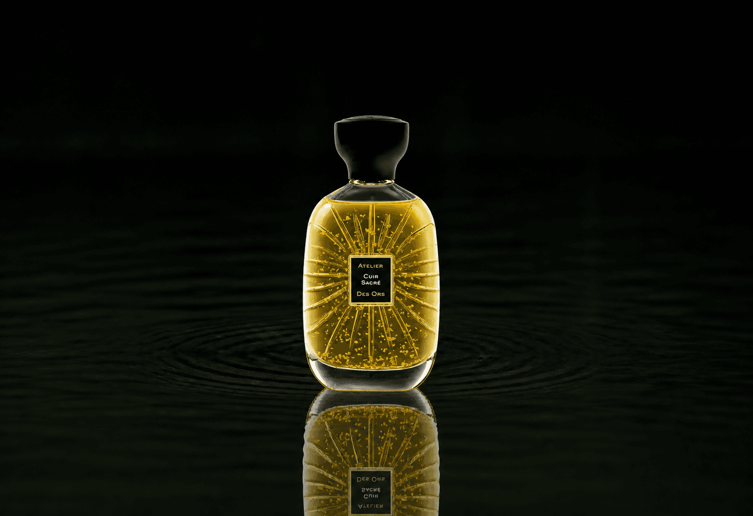 Atelier Des Ors Ors Cuir Sacre fragrance bottle floating above dark water