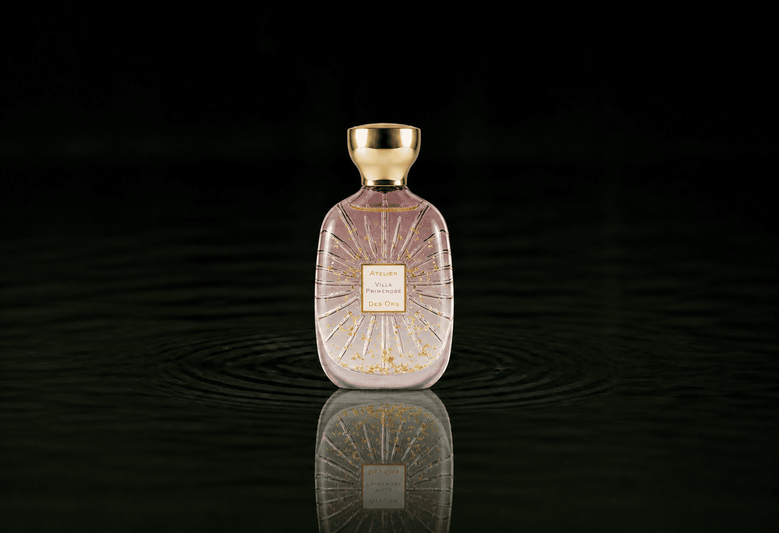 Atelier Des Ors Villa Primerose fragrance bottle floating above dark water