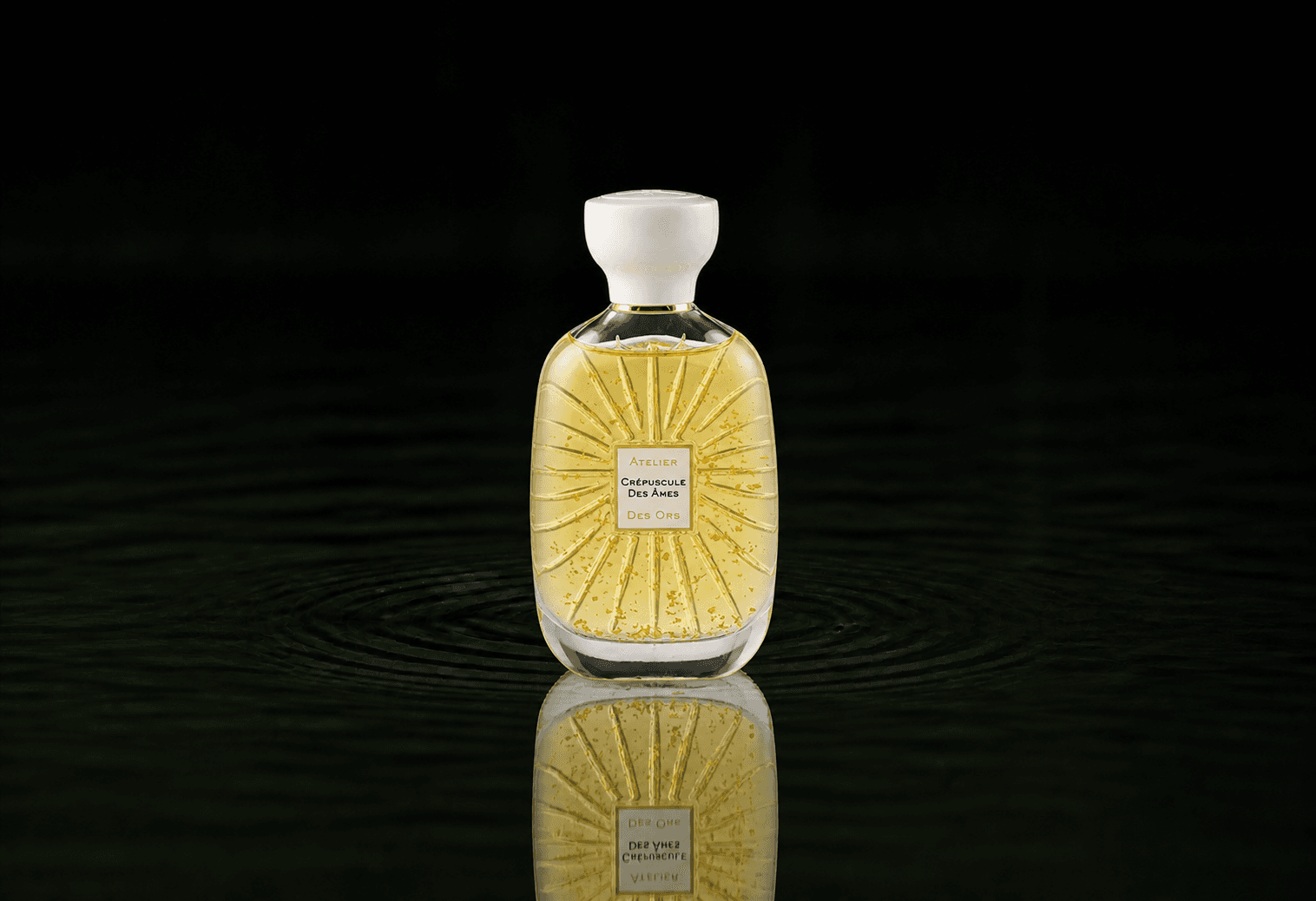 Atelier Des Ors White Collection - Crépuscule des Âmres fragrance bottle floating above dark water