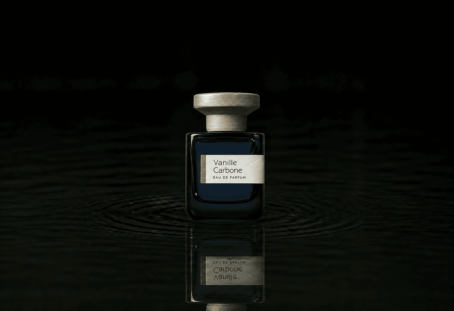Atelier Materi Vanille Carbone fragrance bottle floating above dark water
