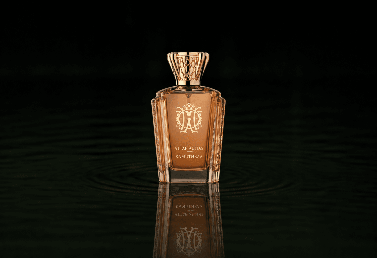 Attar Al Has Kamuthraa fragrance bottle floating above dark water