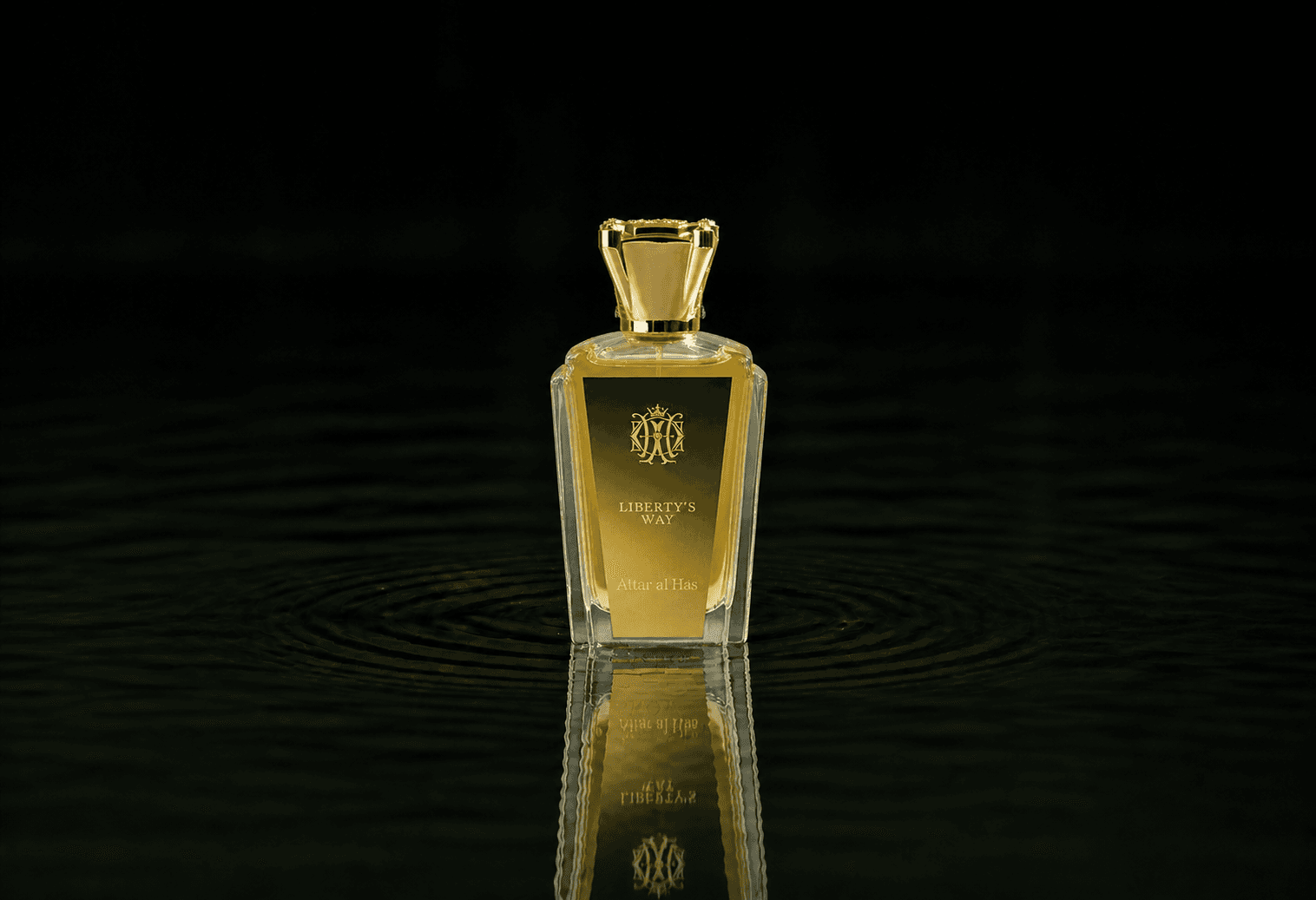 Attar Al Has Libertys Way fragrance bottle floating above dark water