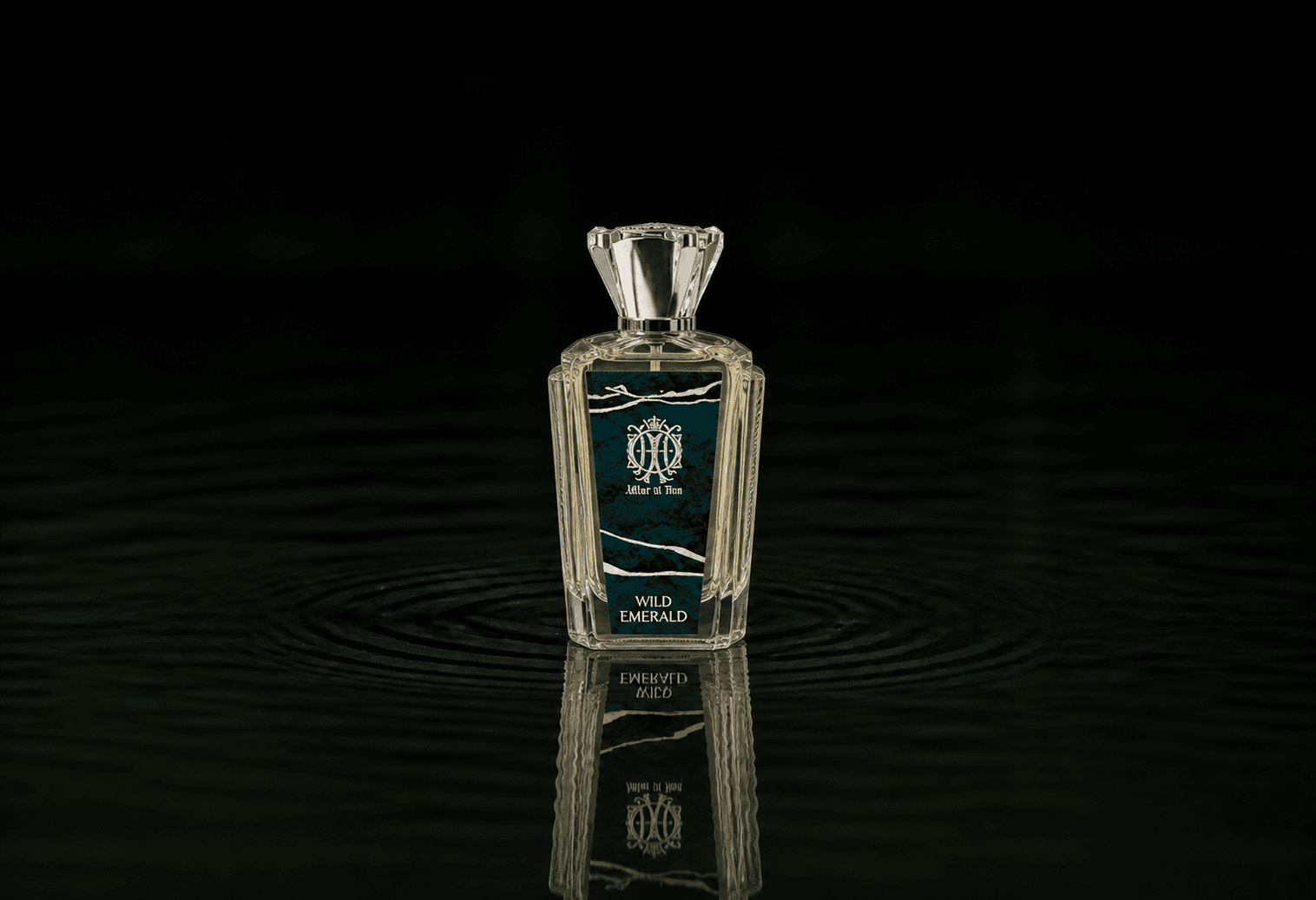 Attar Al Has Wild Emerald fragrance bottle floating above dark water