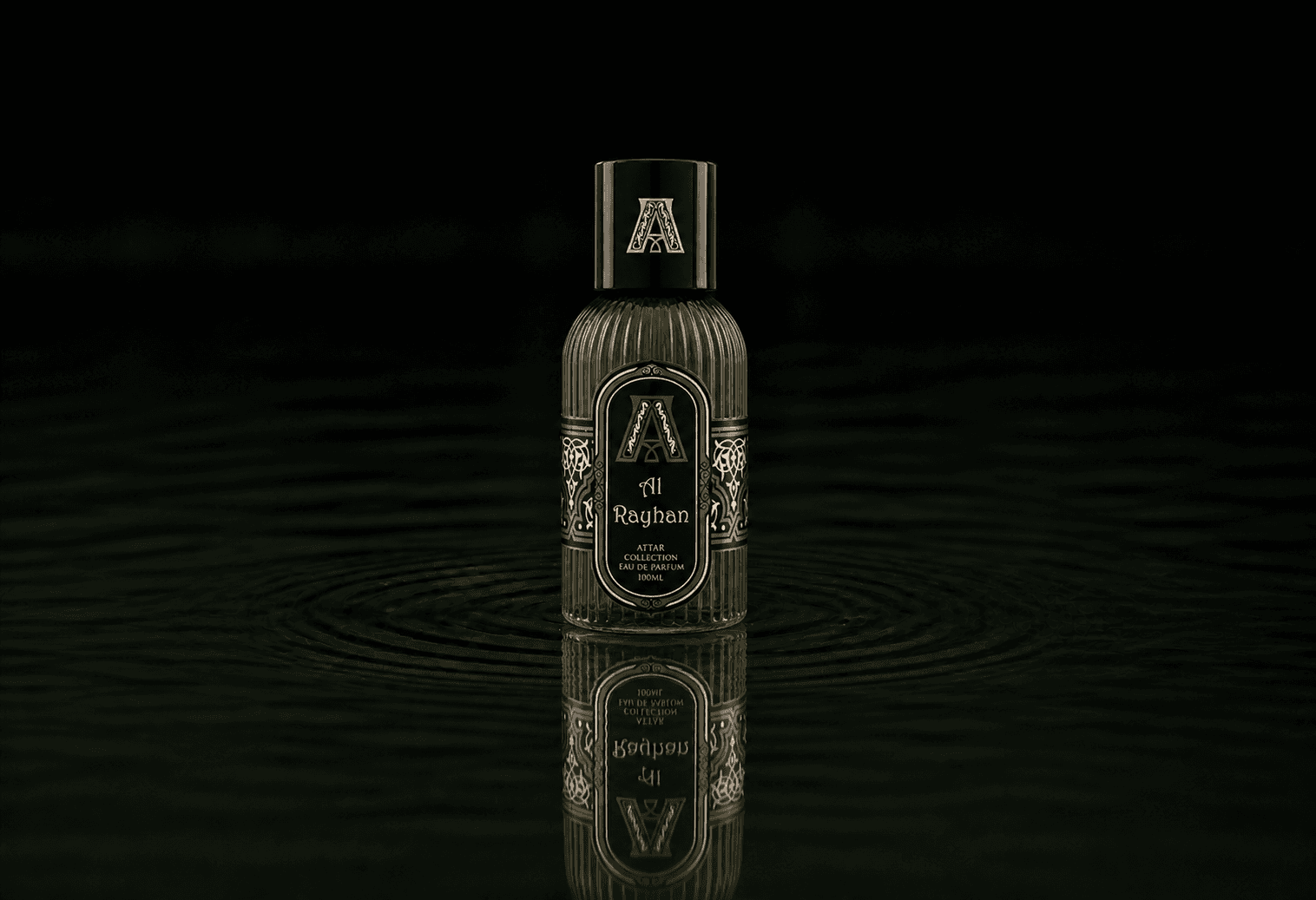 Attar Collection Al Rayhan fragrance bottle floating above dark water