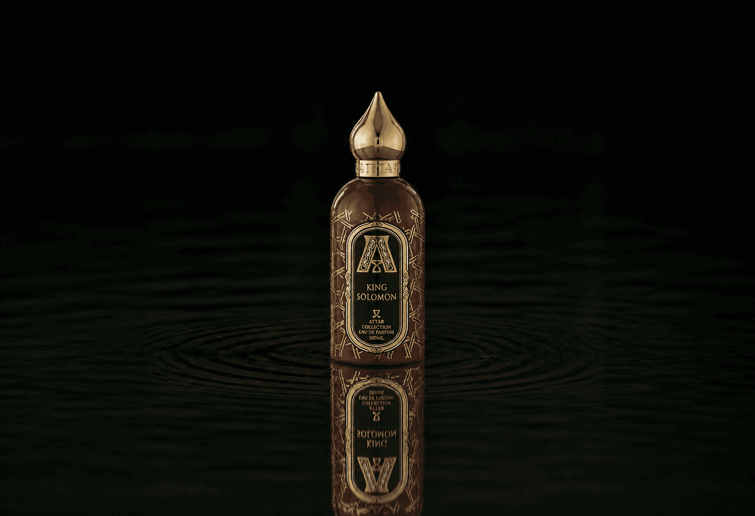 Attar Collection Attar - Collection King Solomon fragrance bottle floating above dark water