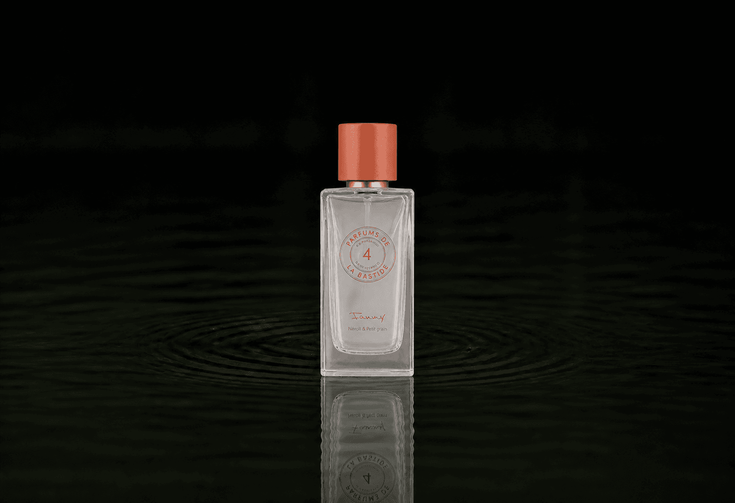Bastide Fanny fragrance bottle floating above dark water