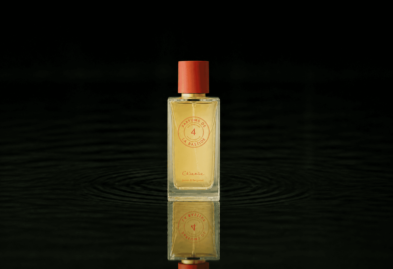 Bastide Farouche fragrance bottle floating above dark water