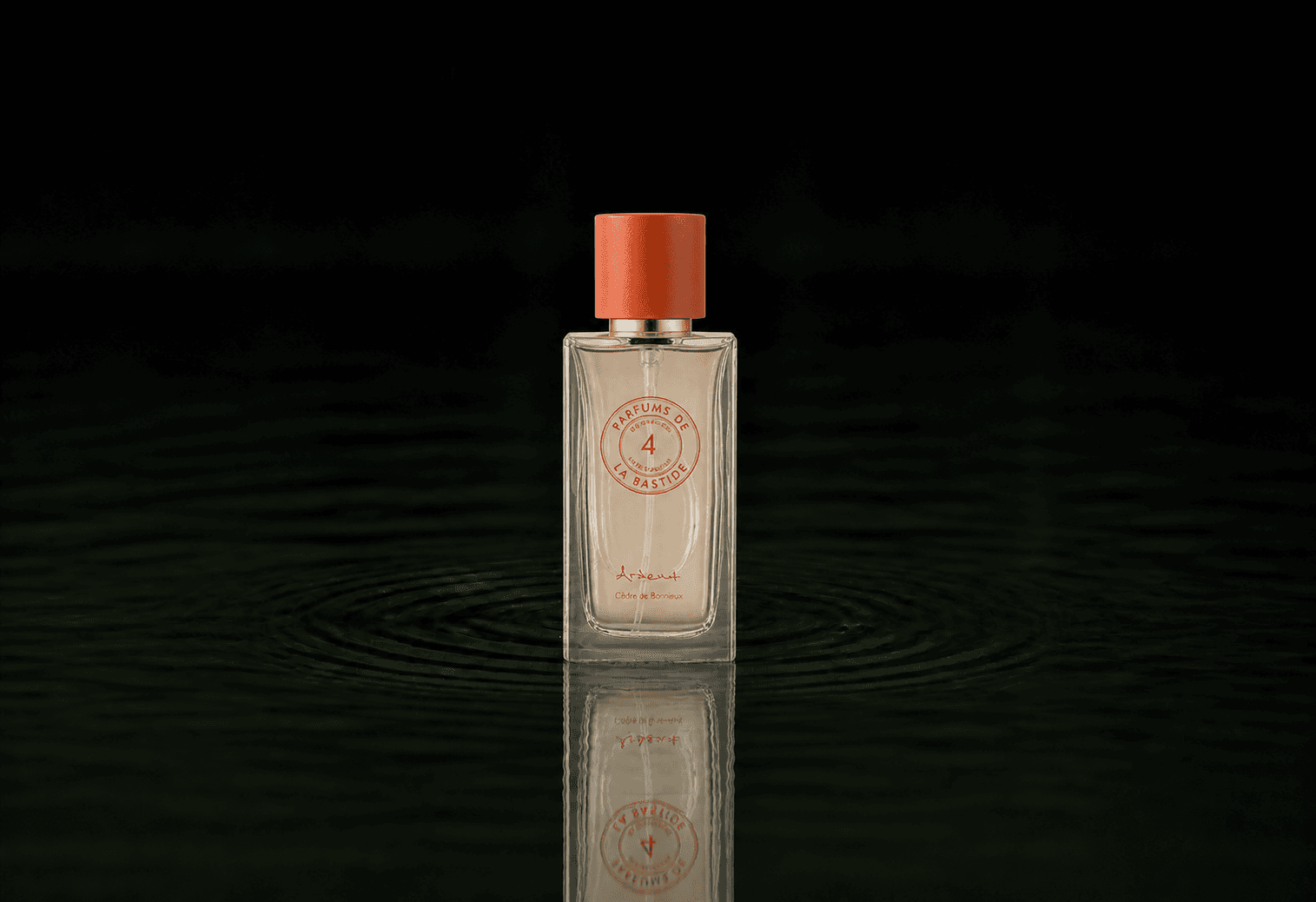 Bastide Marius fragrance bottle floating above dark water