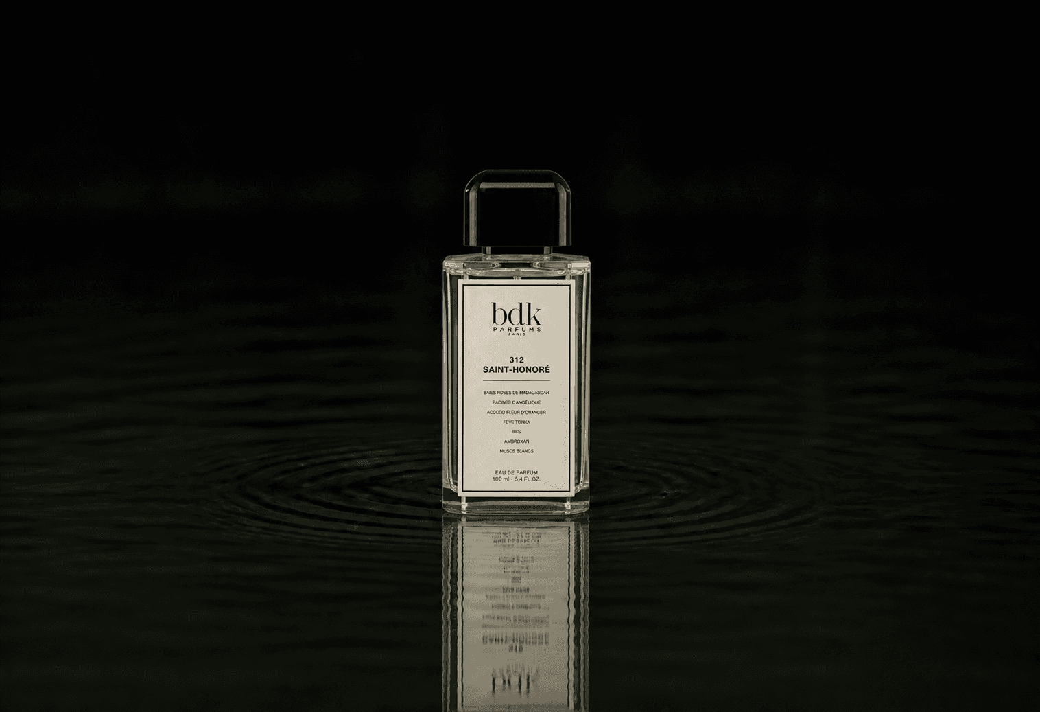 BDK Parfums BDK - 312 Saint Honore fragrance bottle floating above dark water