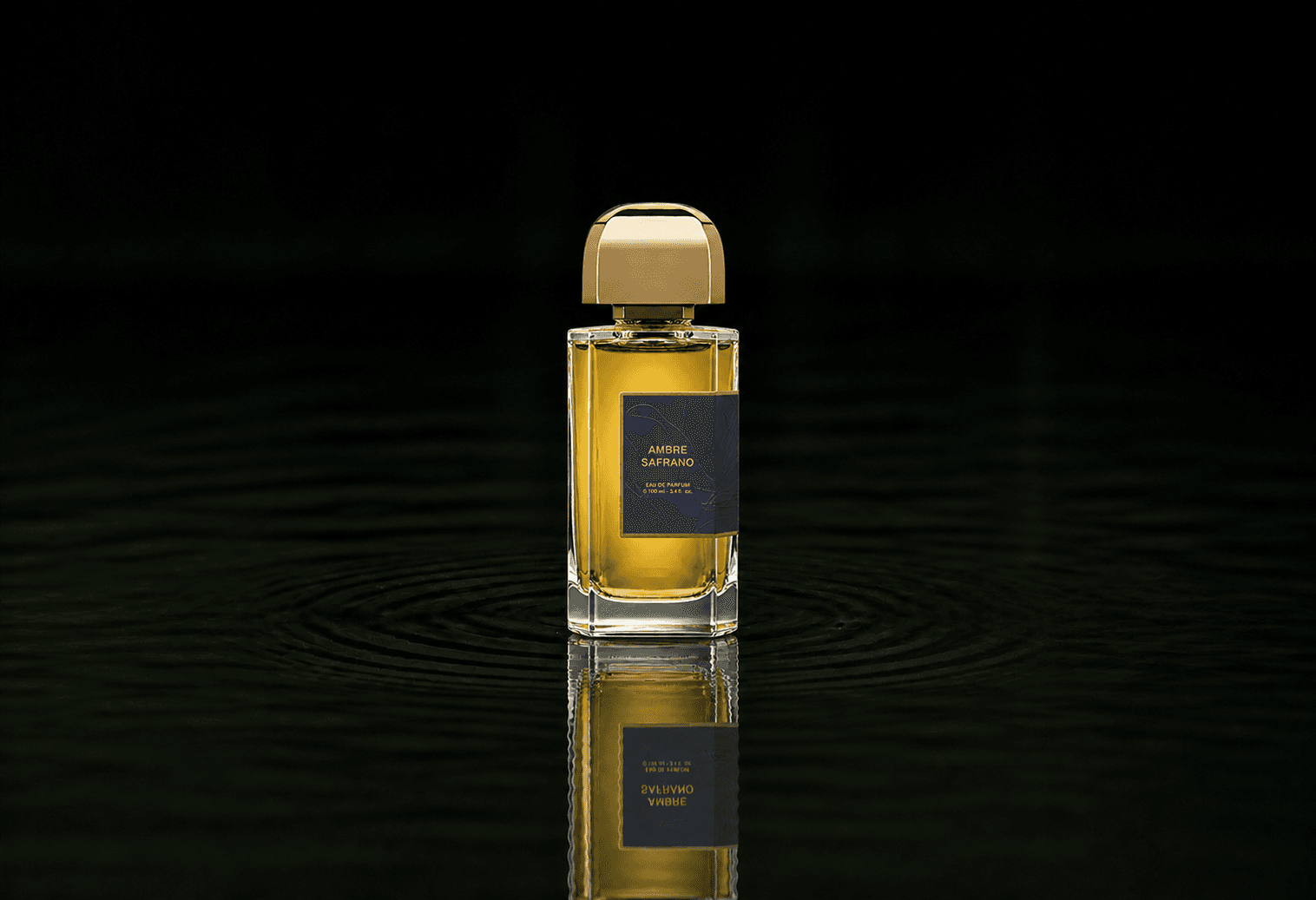 BDK Parfums BDK - Ambre Safrano fragrance bottle floating above dark water