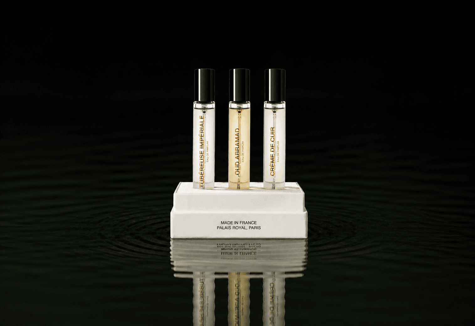 BDK Parfums Bdk - Collection Matieres fragrance bottle floating above dark water