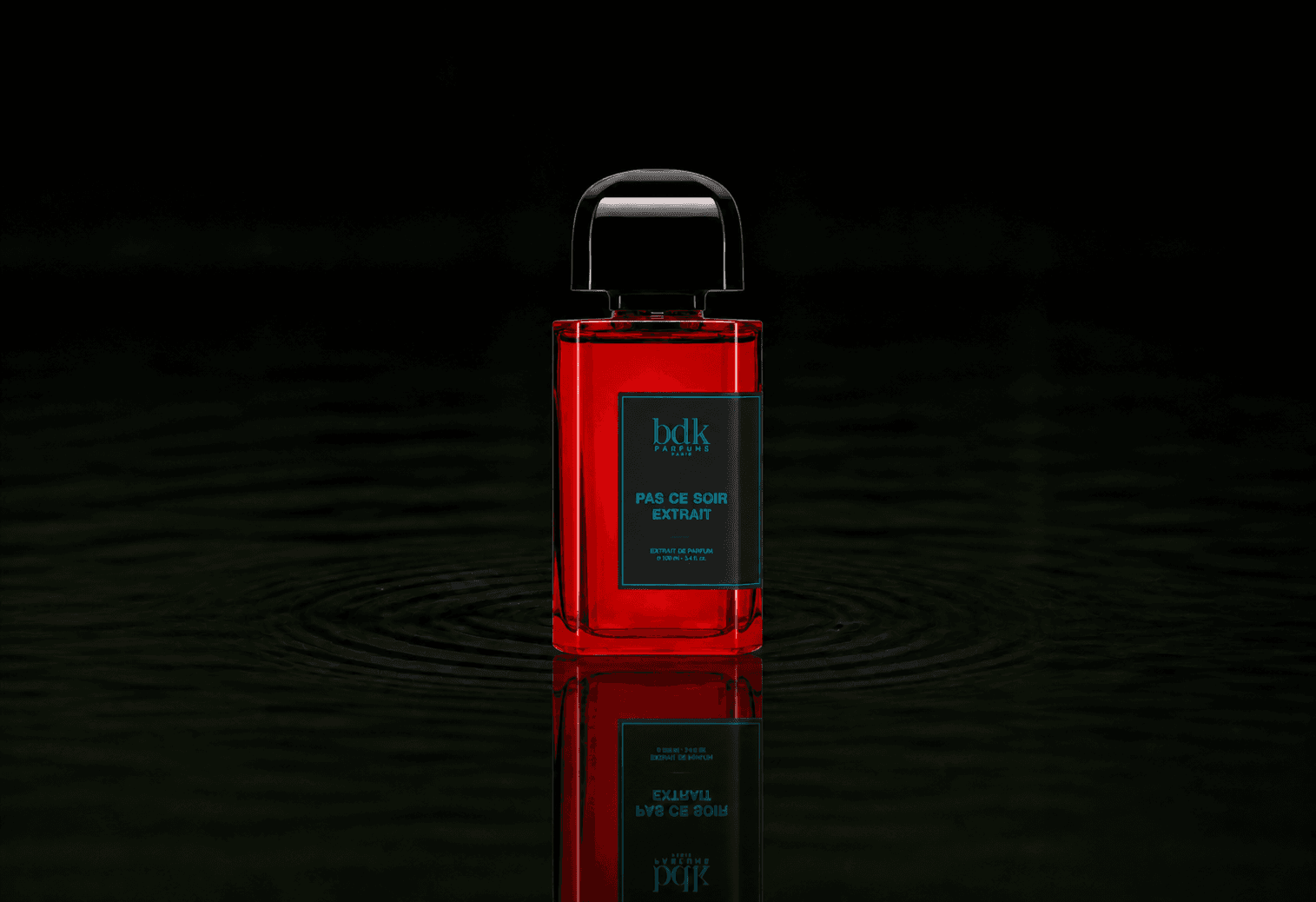 BDK Parfums BDK - Pas ce soir extrait fragrance bottle floating above dark water