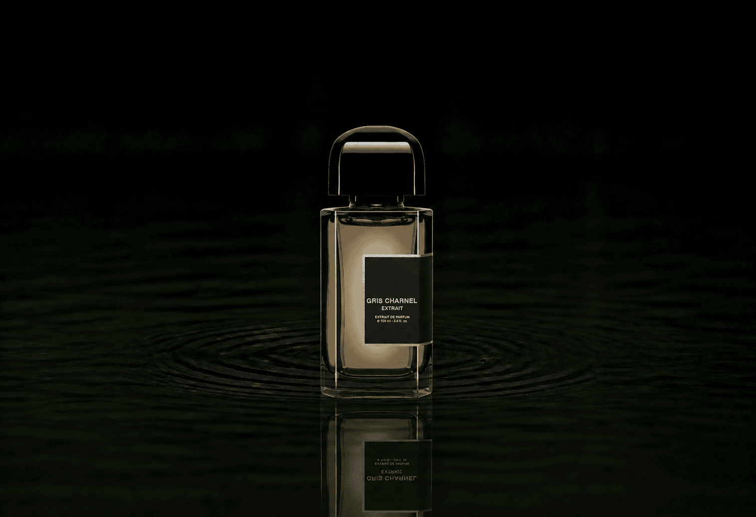 BDK Parfums Gris Charnel Extrait fragrance bottle floating above dark water