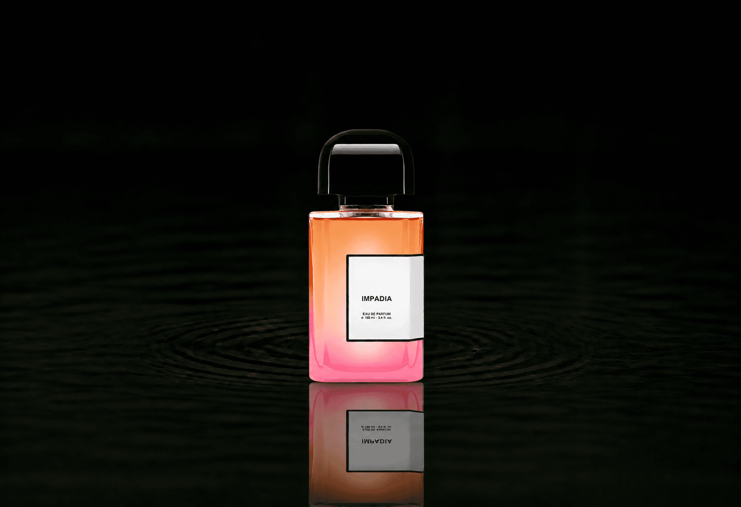 BDK Parfums Impadia fragrance bottle floating above dark water