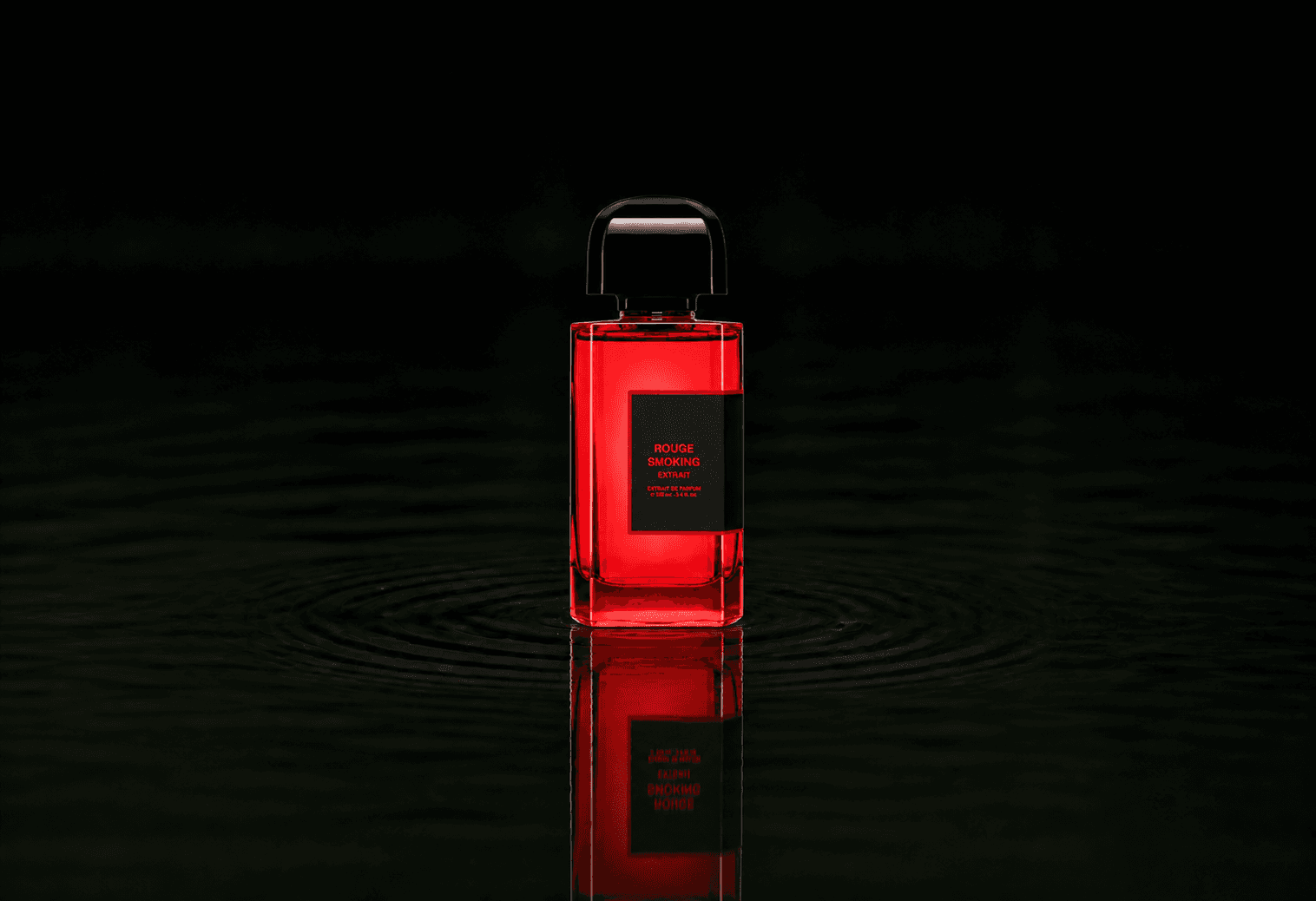 BDK Parfums Rouge Smoking - Extrait fragrance bottle floating above dark water