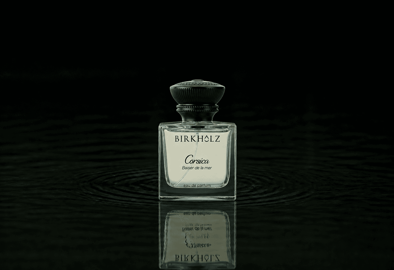 Birkholz Corsica Baiser De La Mer fragrance bottle floating above dark water