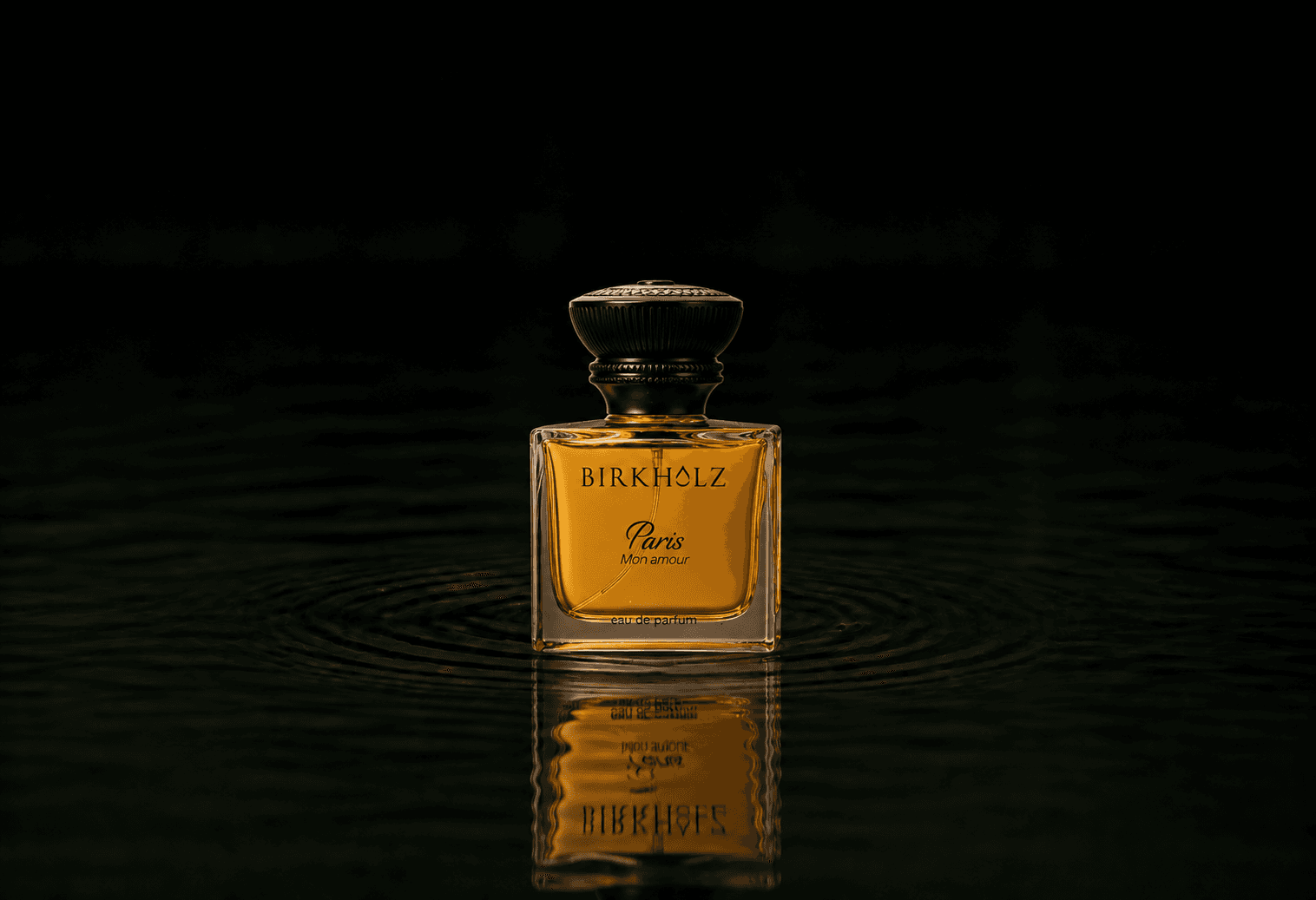 Birkholz Paris Mon Amour fragrance bottle floating above dark water
