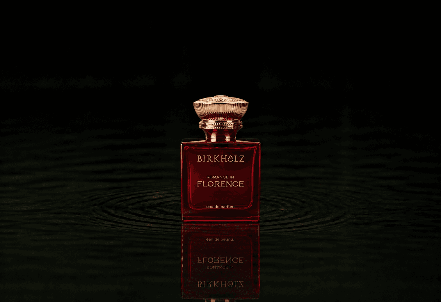 Birkholz Romance In Florence fragrance bottle floating above dark water