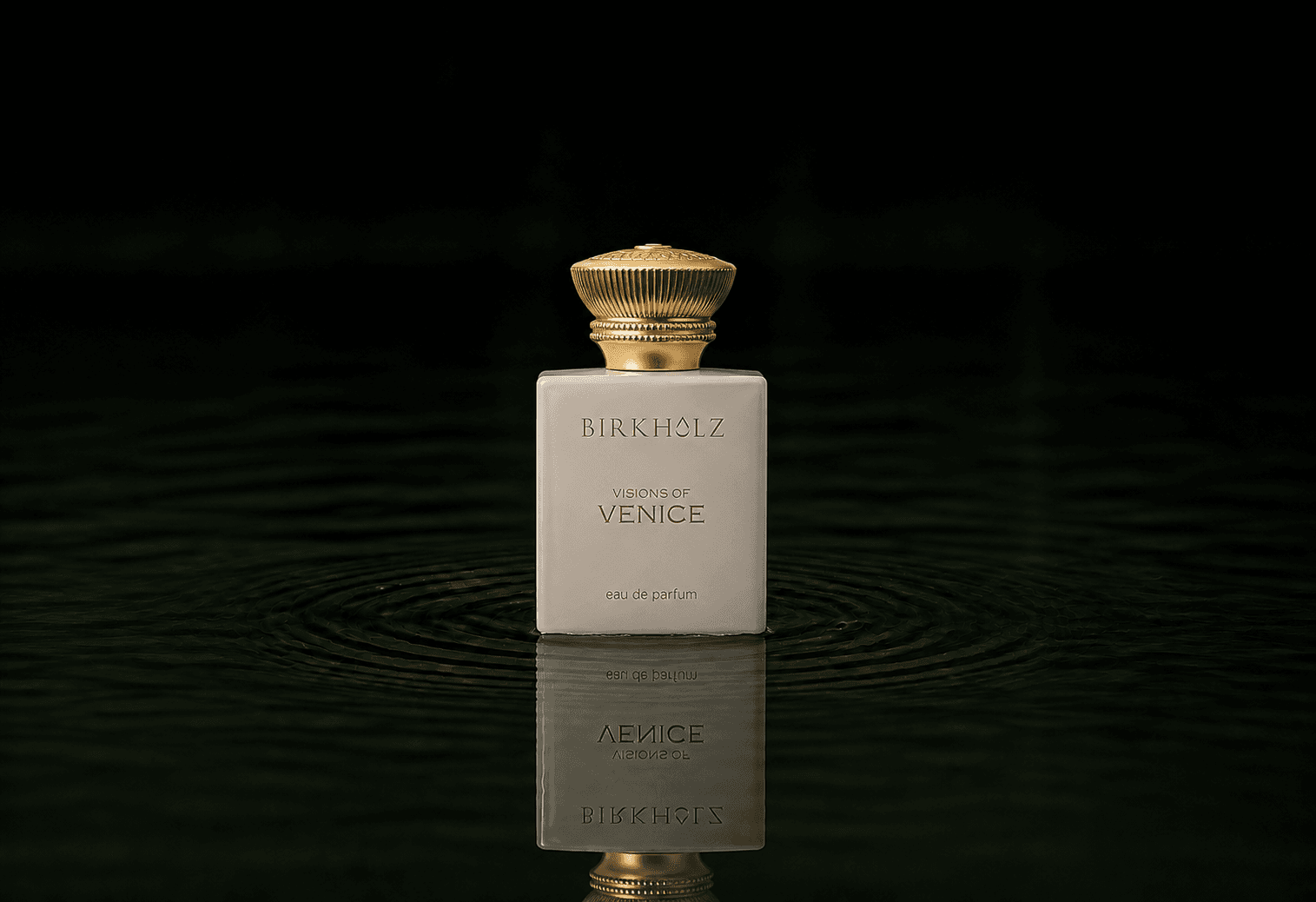 Birkholz Visions of Venice fragrance bottle floating above dark water