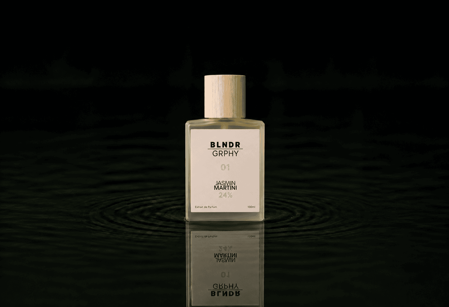 Blndr Grphy 01 Jasmin Martini fragrance bottle floating above dark water
