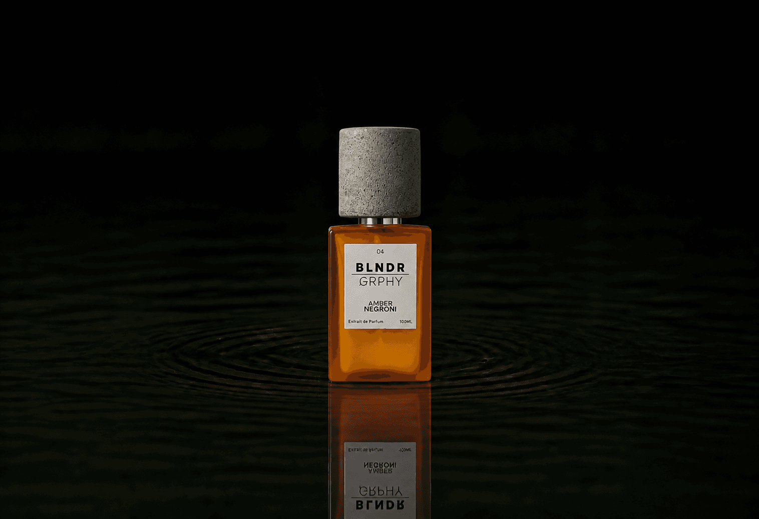 Blndr Grphy 04 Amber Negroni fragrance bottle floating above dark water