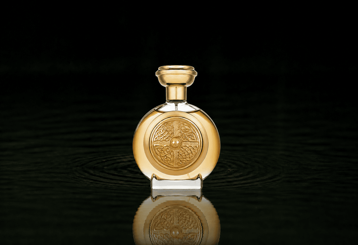 Boadicea The Victorious Defender fragrance bottle floating above dark water