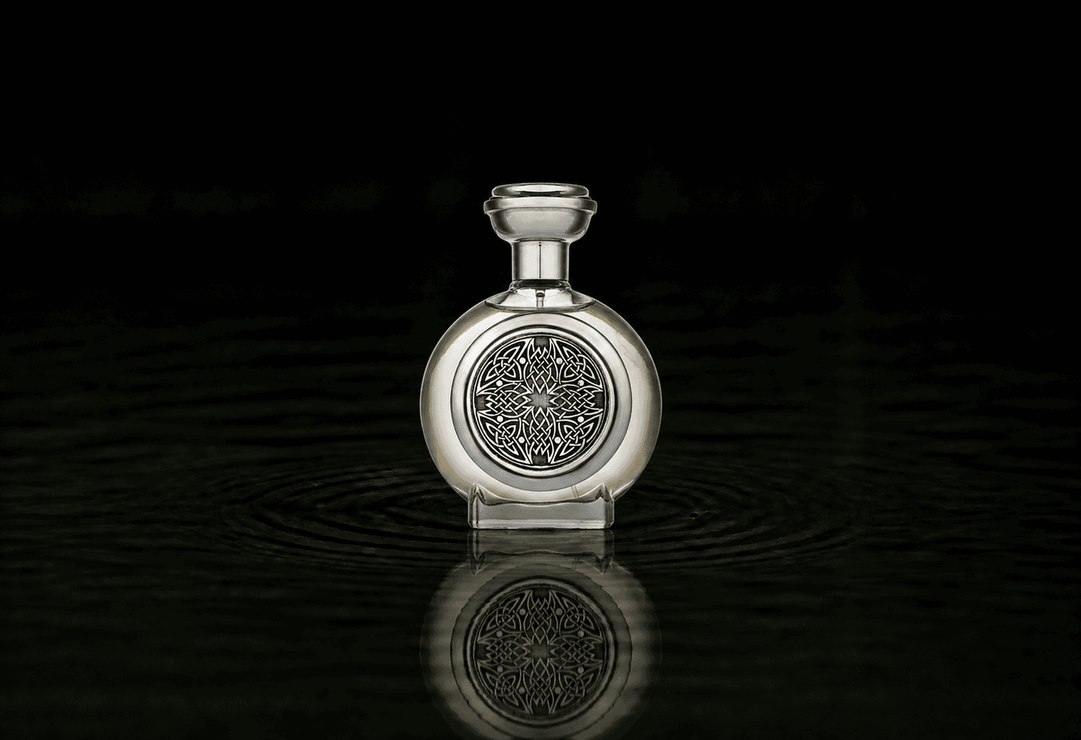 Boadicea The Victorious Glorious parfum fragrance bottle floating above dark water