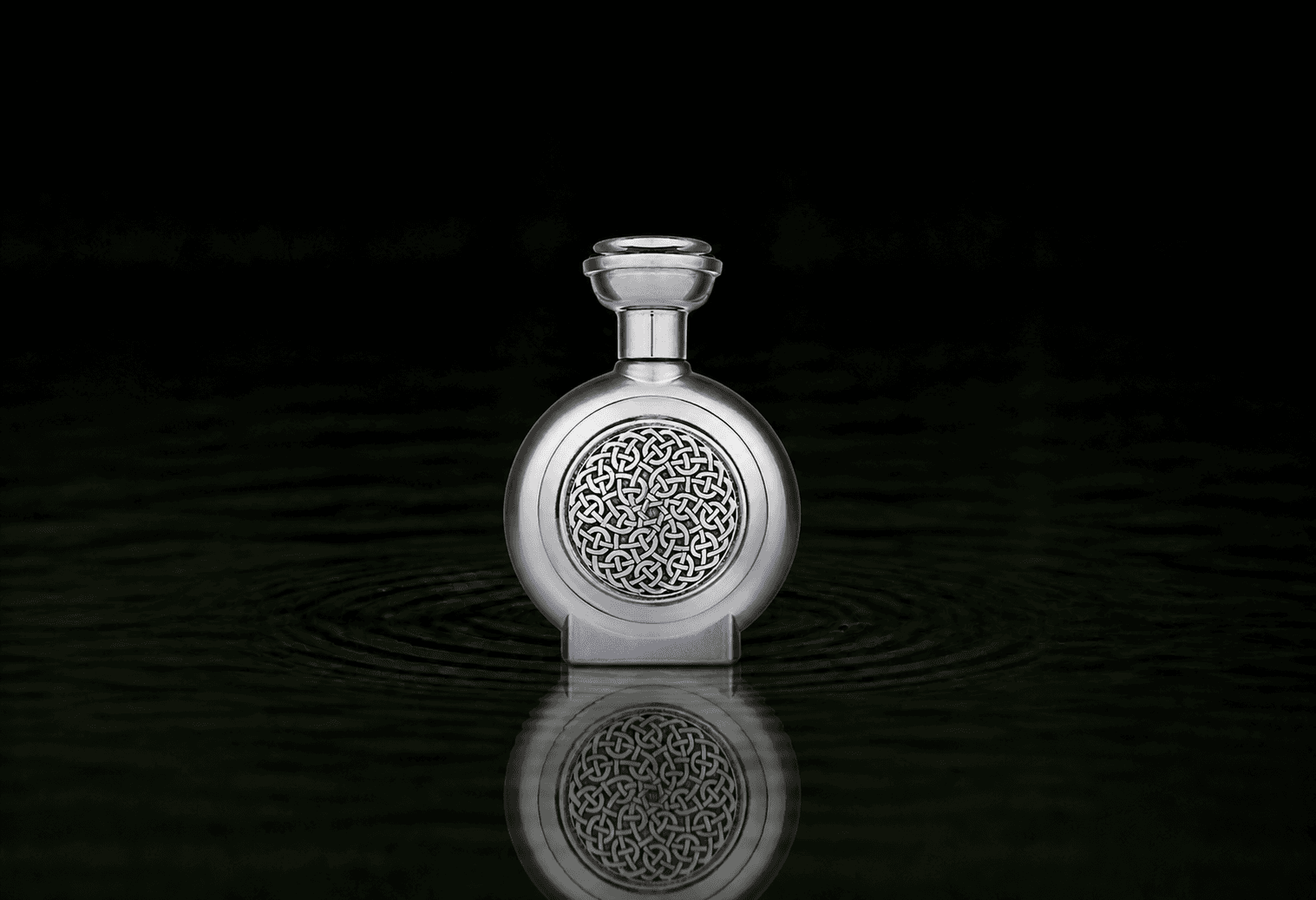Boadicea The Victorious Lavish fragrance bottle floating above dark water