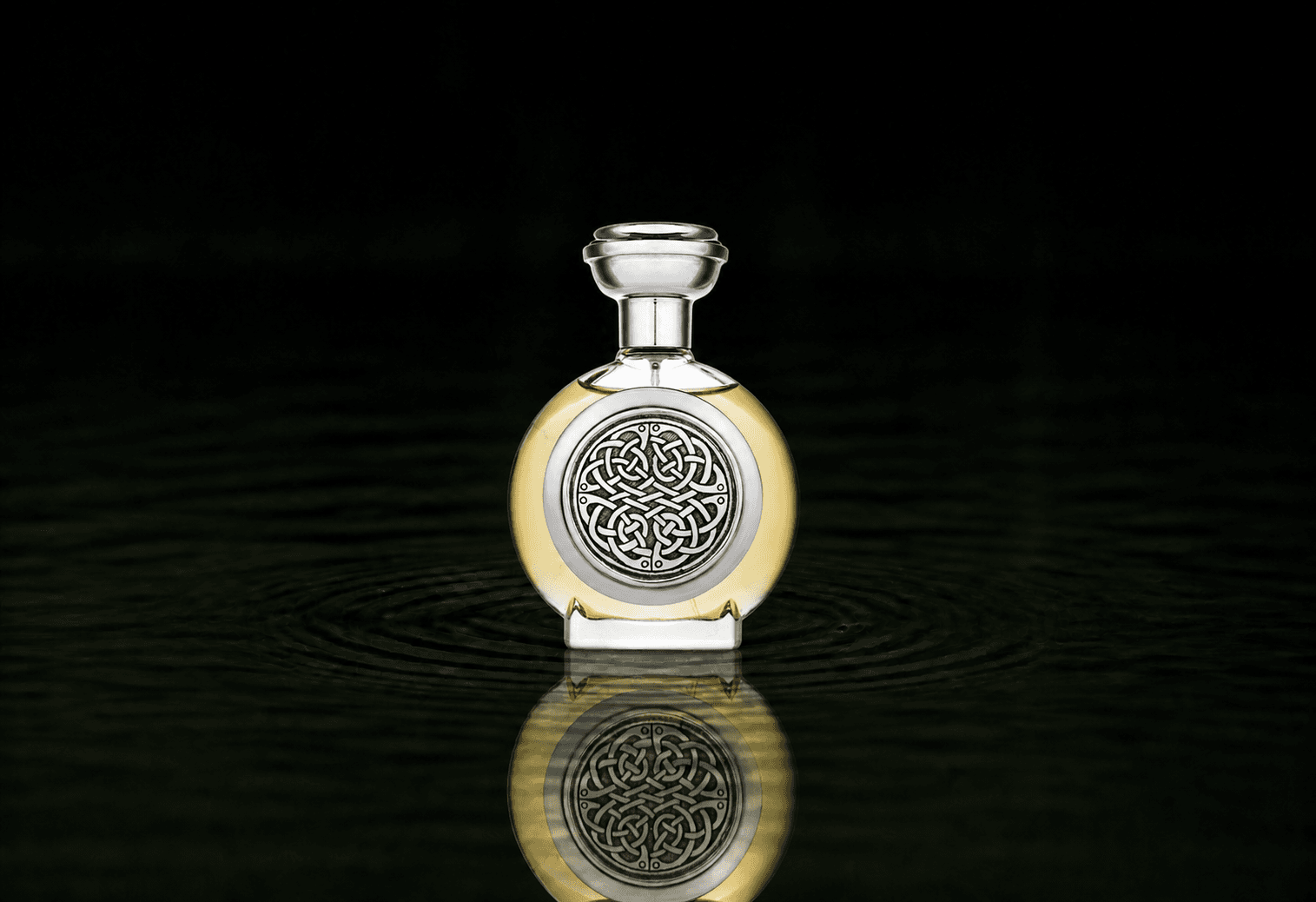 Boadicea The Victorious Rebellious parfum fragrance bottle floating above dark water